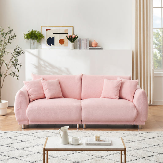 86.6 inch teddy fleece pink sofa with four throw pillows and hardware feet can sit comfortably in an apartment bedroom without taking up space