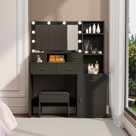 The black vanity with a mirror is equipped with a hair dryer rack, and the dressing tables in the bedroom and dressing room are equipped with dressing mats