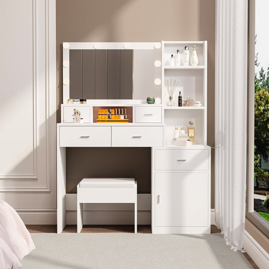 The white vanity with a mirror is equipped with a hair dryer rack, while the vanity in the bedroom and dressing room comes with a dressing pad